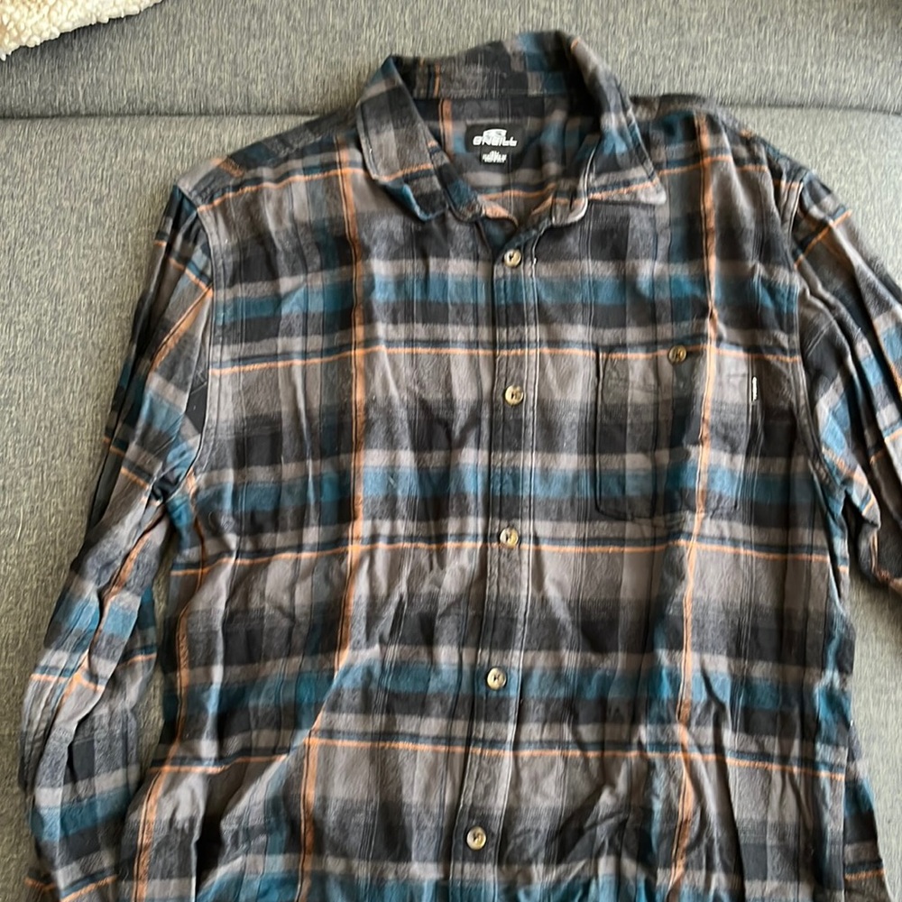 O’Neill flannel. Gary with blue and orange stripes. Size XL.